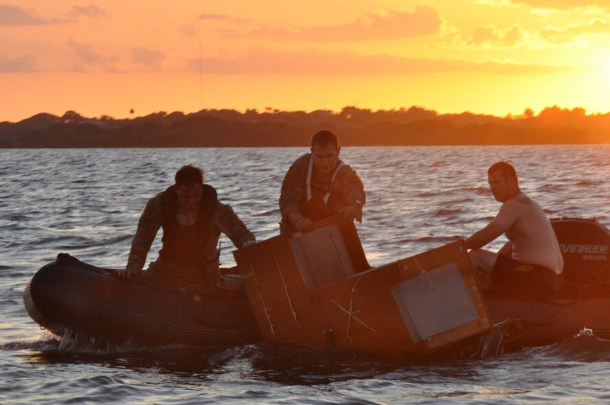 Pararescuemen complete the deployment of a rigging alternate method Zodiac (RAMZ), a packaged cargo cube containing an inflatable, motorized Zodiac boat that is dropped from a plane, off the coast of Patrick Air Force Base, Fla, August 20. The RAMZ training is part of a rescue jumpmaster course being hosted by the 920th Rescue Wing, the Air Force Reserve’s only combat rescue unit. (U.S. Air Force photo/ Tech. Sgt. Katie Spencer)