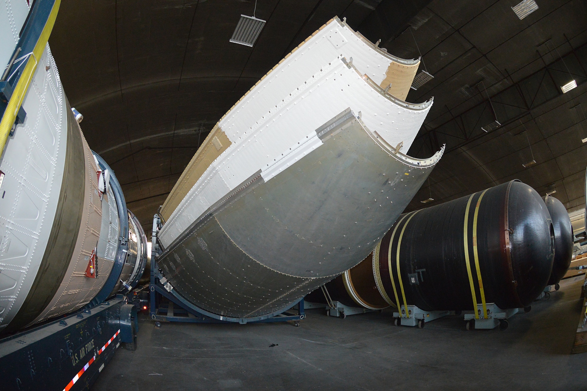 DAYTON, Ohio (08/2014) -- The Titan IVB space launch vehicle in the restoration hangar at the National Museum of the United States Air Force. These are sections of the payload fairings. (U.S. Air Force photo)