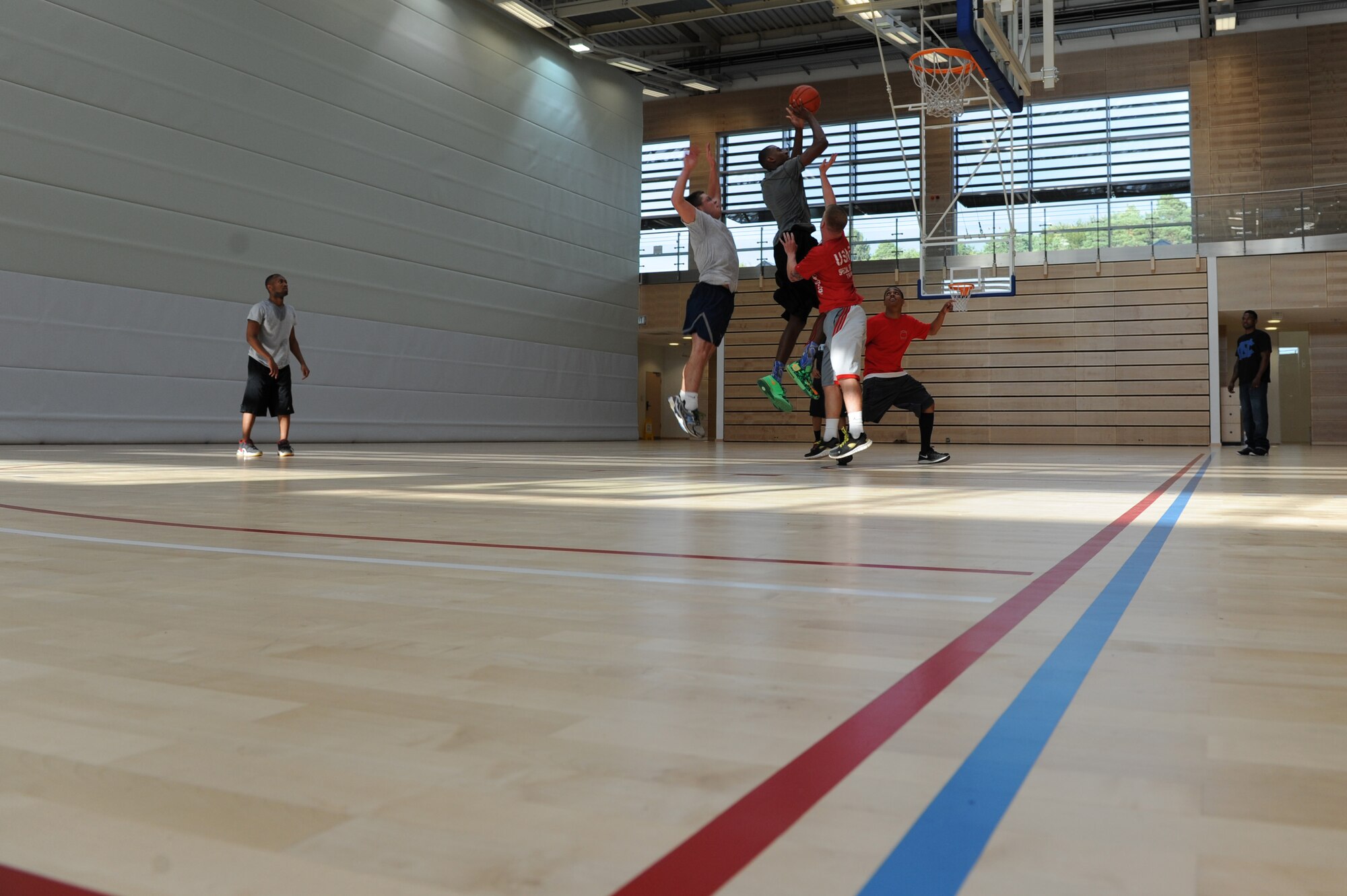 U.S. Air Force Airmen compete during the three-on-three basketball tournament for the second annual Dorm Wars competition Aug. 28, 2014, at Spangdahlem Air Base, Germany. Dormitories earned a certain number of points depending on the tournament’s standings. (U.S. Air Force photo by Airman 1st Class Dylan Nuckolls/Released)