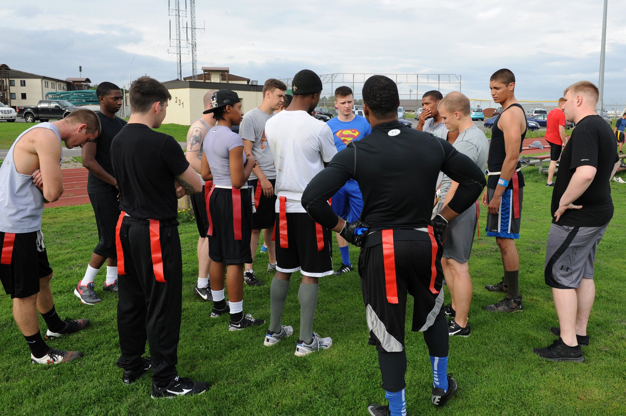 U.S. Air Force Airmen from dormitory 134 huddle during halftime of the second annual Dorm Wars competition flag football championship game Aug. 26, 2014, at Spangdahlem Air Base, Germany. Dorm 134 took home first place, winning by three touchdowns. (U.S. Air Force photo by Airman 1st Class Dylan Nuckolls/Released)
