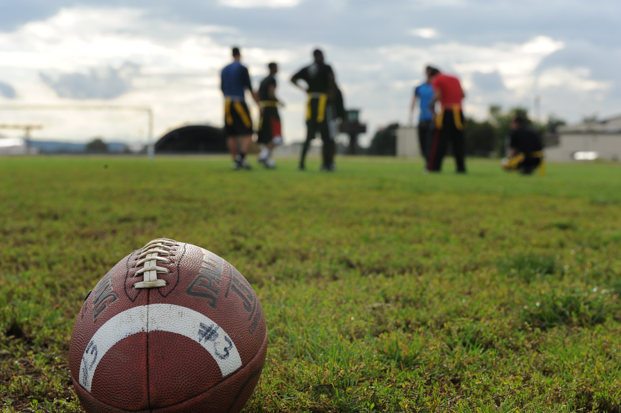 A football remains on a field during halftime of the second annual Dorm Wars competition flag football championship game Aug. 26, 2014, at Spangdahlem Air Base, Germany. The 52nd Force Support Squadron and the First Sergeants Council hosted the Dorm Wars competition. (U.S. Air Force photo by Airman 1st Class Dylan Nuckolls/Released)