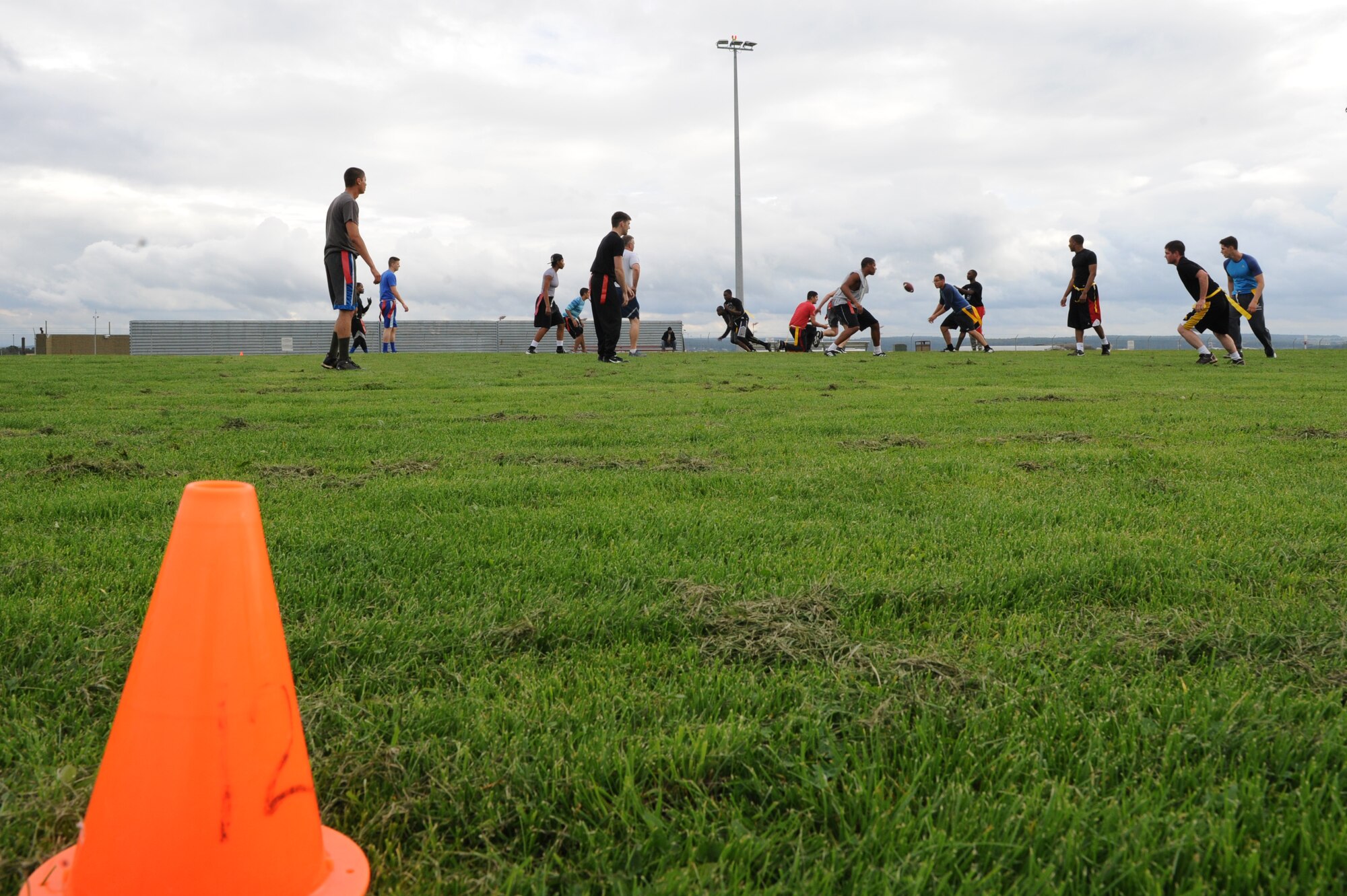 U.S. Air Force Airmen compete in flag football during the second annual Dorm Wars competition Aug. 26, 2014, at Spangdahlem Air Base, Germany. More than 15 different events make up the month-long Dorm Wars competition. (U.S. Air Force photo by Airman 1st Class Dylan Nuckolls/Released)