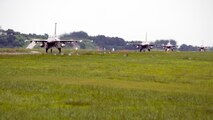F-16 Fighting Falcons from Kunsan Air Base and South Korean KF-16s taxi to the runway together during Exercise Buddy Wing 14-8 at Seosan Air Base, Republic of Korea, Aug. 20, 2014. The purpose of the exercise was not only to improve interoperability between U.S. Air Force and ROKAF fighter squadrons, but to practice with ROKAF KF-16 units for their first upcoming RED FLAG exercise in Alaska. (U.S. Air Force photo by Senior Airman Taylor Curry/Released)