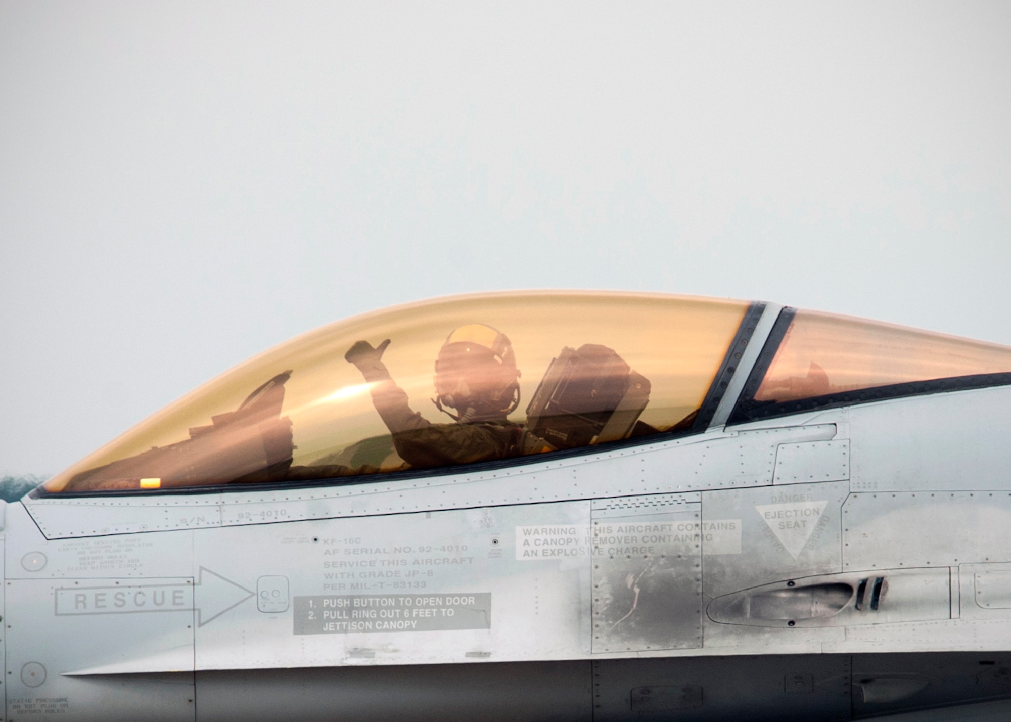 A Republic of Korea Air Force pilot gives a thumbs-up gesture while taxiing to the runway during Exercise Buddy Wing 14-8 at Seosan Air Base, ROK, Aug. 20, 2014.  The purpose of the exercise was not only to improve interoperability between U.S. Air Force and ROKAF fighter squadrons, but to practice with ROKAF KF-16 units for their first upcoming RED FLAG exercise in Alaska. (U.S. Air Force photo by Senior Airman Taylor Curry/Released)