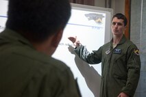 U.S. Air Force Capt. Jacob Allen, 35th Fighter Squadron instructor pilot and exercise project officer, provides flight academics to Republic of Korea Air Force pilots at Seosan Air Base, ROK, Aug. 19, 2014. ROKAF KF-16 pilots received this training in preparation for their first flight over the Pacific Ocean to RED FLAG-Alaska. (U.S. Air Force photo by Senior Airman Taylor Curry/Released) 