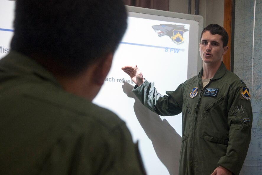 U.S. Air Force Capt. Jacob Allen, 35th Fighter Squadron instructor pilot and exercise project officer, provides flight academics to Republic of Korea Air Force pilots at Seosan Air Base, ROK, Aug. 19, 2014. ROKAF KF-16 pilots received this training in preparation for their first flight over the Pacific Ocean to RED FLAG-Alaska. (U.S. Air Force photo by Senior Airman Taylor Curry/Released) 