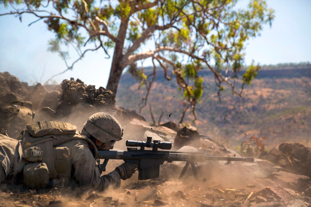 U.S. Marine Corps Lance Cpl. Mina S. Gadelkarim engages targets using an M107 .50 caliber special application scoped rifle as part of an unknown distance qualification range during Exercise Koolendong 14 at Bradshaw Field Training Area, Australia, Aug. 18, 2014. Gadelkarim is a rifleman assigned to Scout Sniper Platoon, 1st Battalion, 5th Marine Regiment.