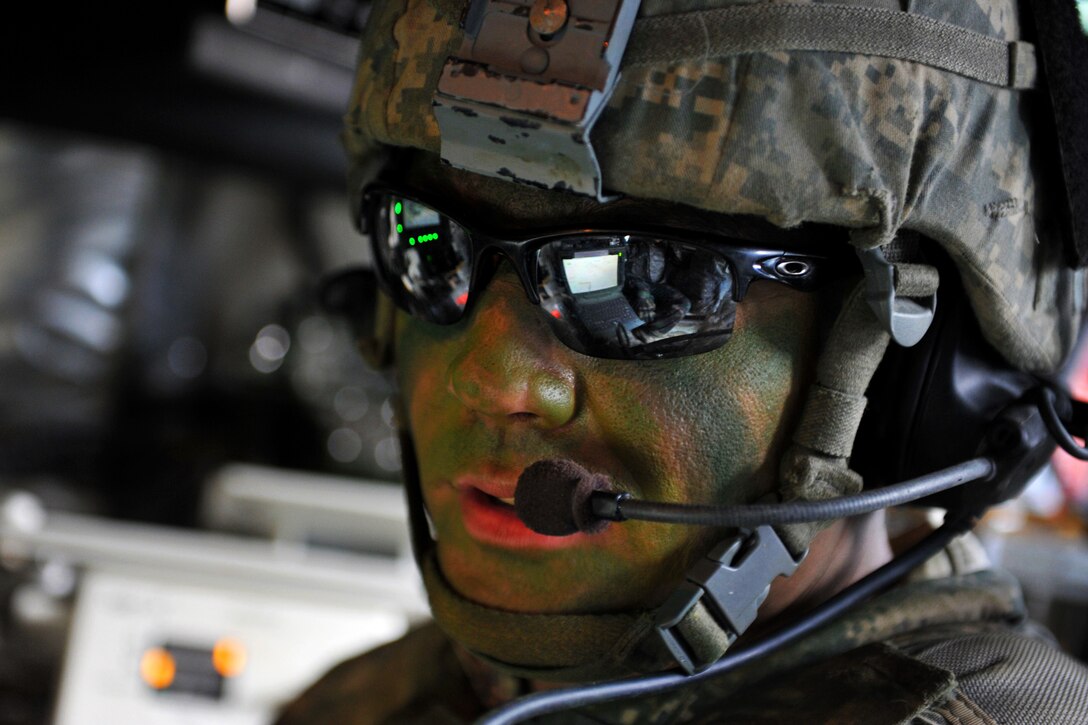 Army Staff Sgt. Shannon Talley coordinates a mortar barrage as his soldiers train with airmen to hone joint interoperability and close air support capabilities in a simulated combat environment during the Red Flag-Alaska 14-3 exercise on Yukon Training Area, Alaska, Aug. 21, 2014. Red Flag-Alaska is a series of Pacific Air Forces commander-directed exercises providing joint offensive counter-air, interdiction, close air support and large-force employment training. Talley is assigned to the 1st Cavalry Regiment, 1st Stryker Brigade Combat Team, Alaska.