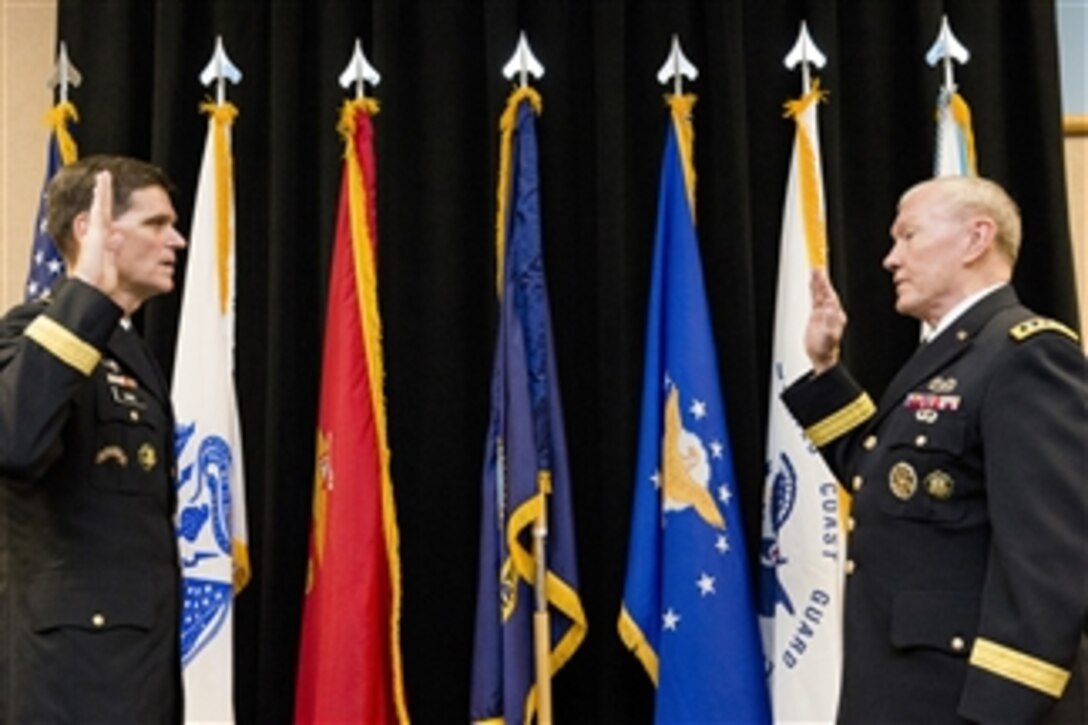 Army Gen. Martin E. Dempsey, right, chairman of the Joint Chiefs of Staff, administers the oath of office to Army Gen. Joseph L. Votel III during the change-of-command ceremony for U.S. Special Operations Command in Tampa, Fla., Aug. 28, 2014. Votel assumed command from Navy Adm. William H. McRaven. 