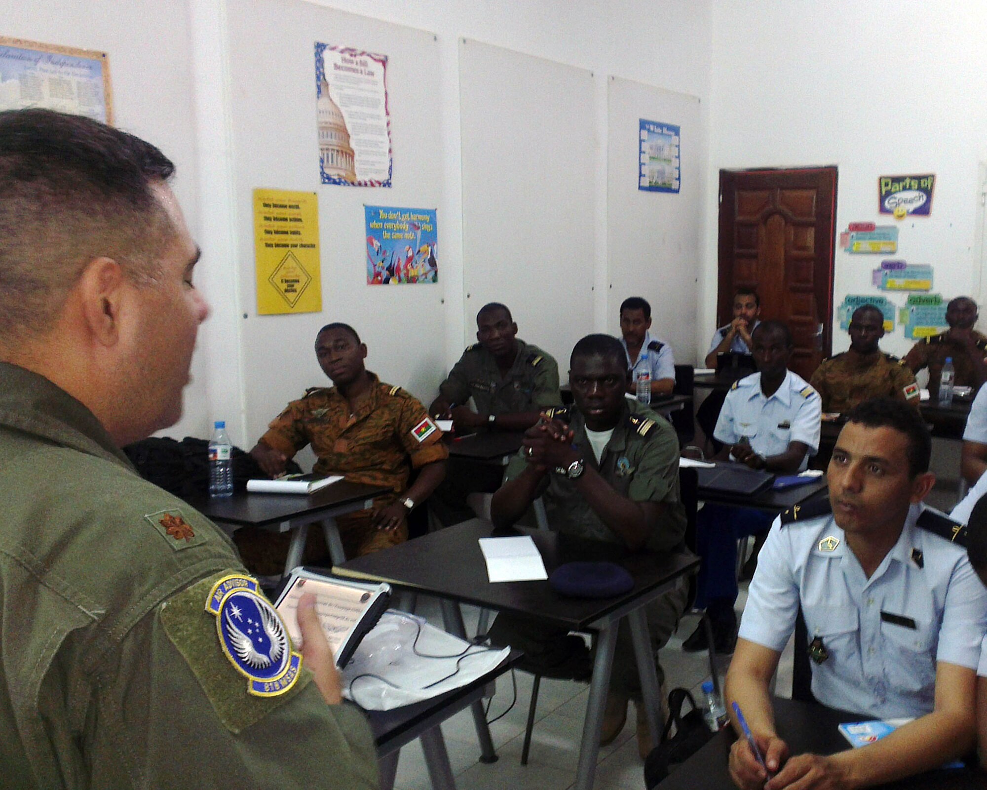 U.S. Air Force Maj. Jean-Andre Parmiter, flight safety instructor from the 818th Mobility Support Advisory Squadron, Joint Base McGuire-Dix-Lakehurst, N.J., teaches students from six African nations on flight safety during African Partnership Flight Mauritania, in Atar, Mauritania, Aug. 31, 2014. This is the fourth APF co-hosted by the U.S. Air Force and the first APF to be co-hosted by the Mauritanian government and is designed to increase partnerships and share learning techniques designed to help all participating nations fight terrorism in the region. (U.S. Air Force photo/Master Sgt. Brian Boisvert/Released)