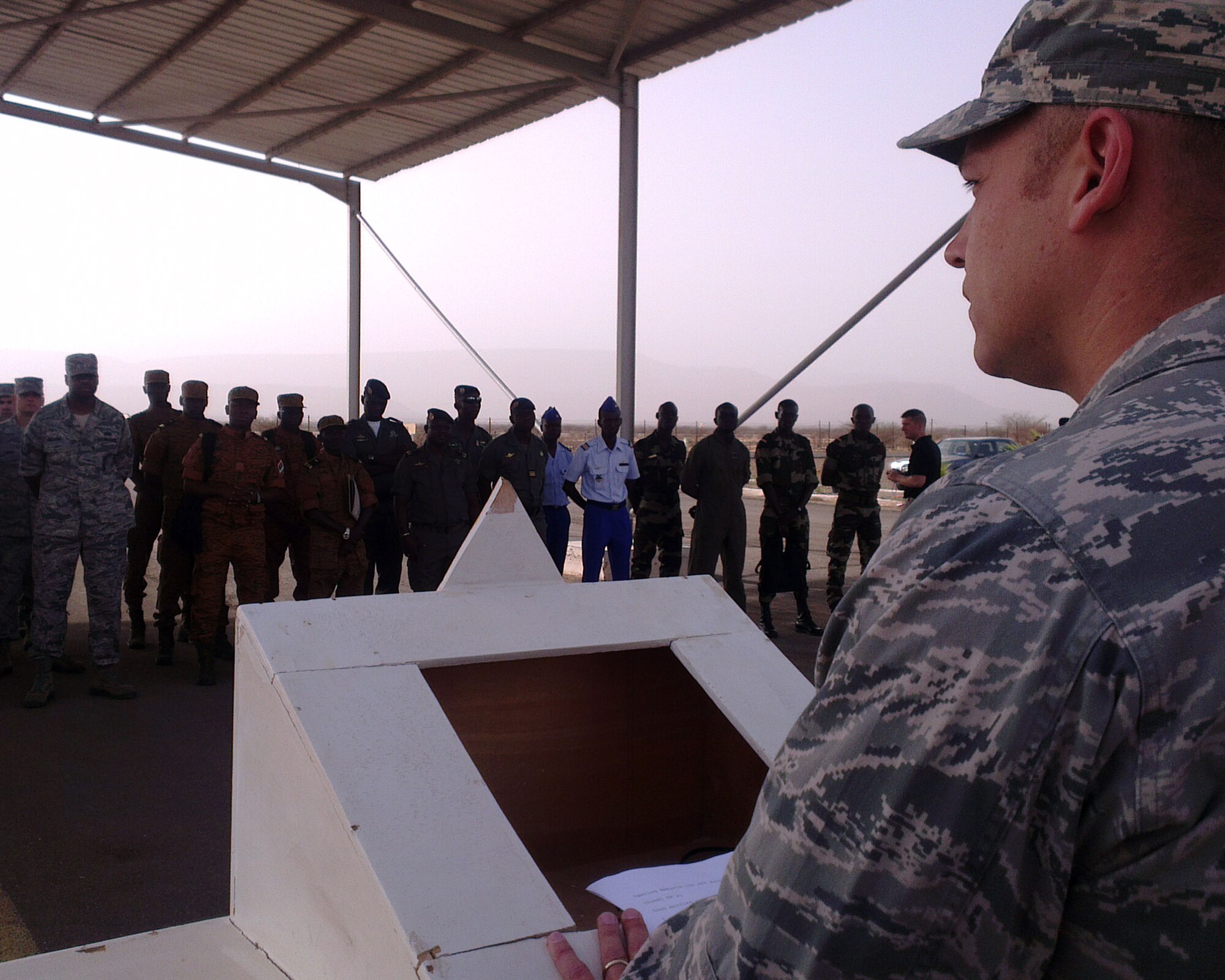 U.S. Air Force Maj. Hartmut Casson, African Partnership Flight Mauritania mission commander, speaks during the opening ceremony that marked the beginning of a four-day training event in Atar, Mauritania, Aug. 31, 2014. During his welcoming speech, Casson said that in addition to the skills that will be taught, it is the hope of the U.S. team that lessons and friendships formed this week will endure for years to come. This is the third APF this year and the first APF in Mauritania with a goal to help the six African nations that are represented during this event build aviation capacity, enhance regional cooperation and increase interoperability throughout the region. (U.S. Air Force photo/Master Sgt. Brian Boisvert/Released)