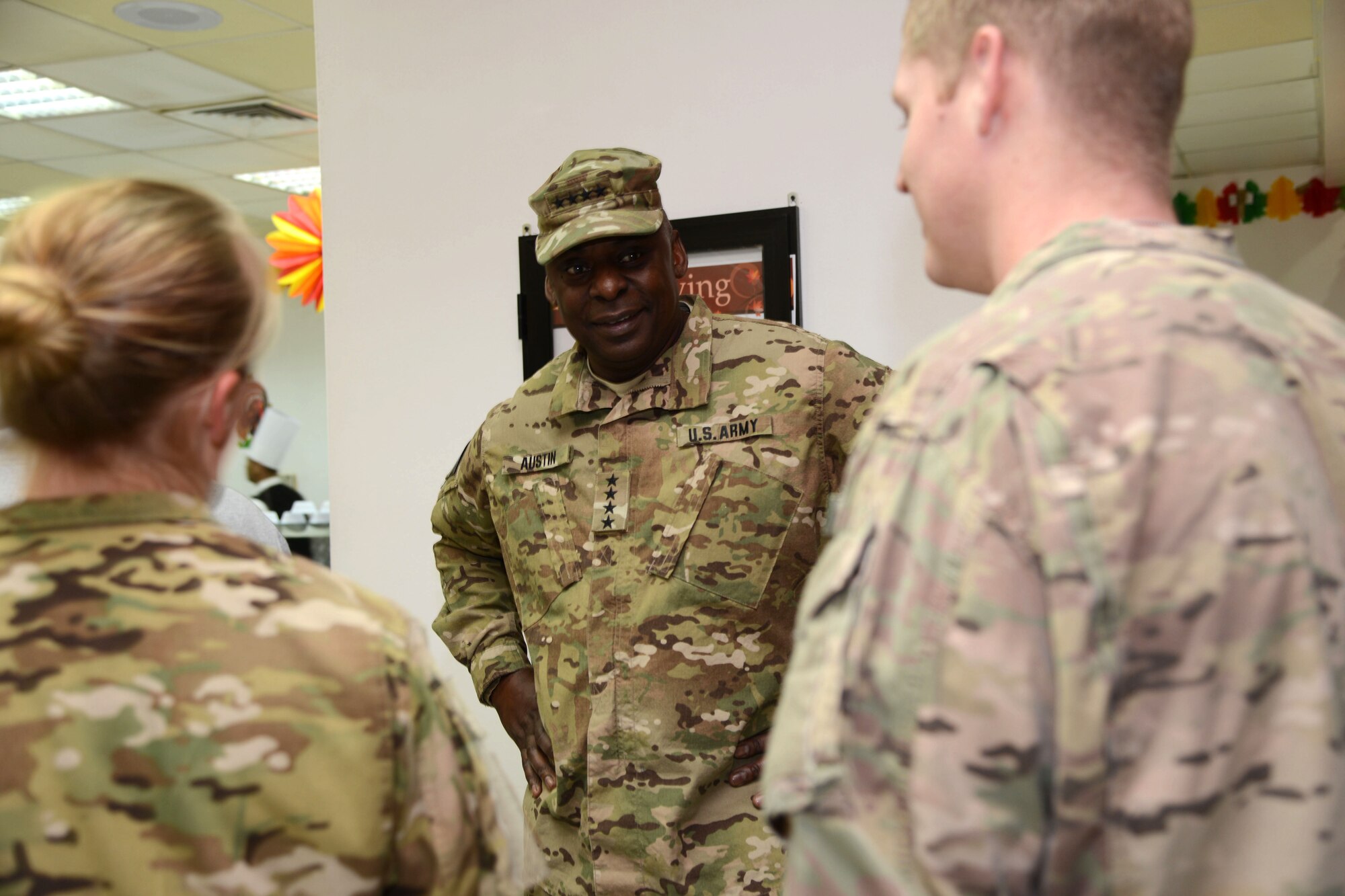 SOUTHWEST ASIA - U.S. Army Gen. Lloyd J. Austin III, U.S. Central Command commander, greets joint and coalition service members on Thanksgiving here Nov. 27. Austin spent the day serving meals and talking to service members. (U.S. Air Force photo by Tech. Sgt. Jared Marquis/released)