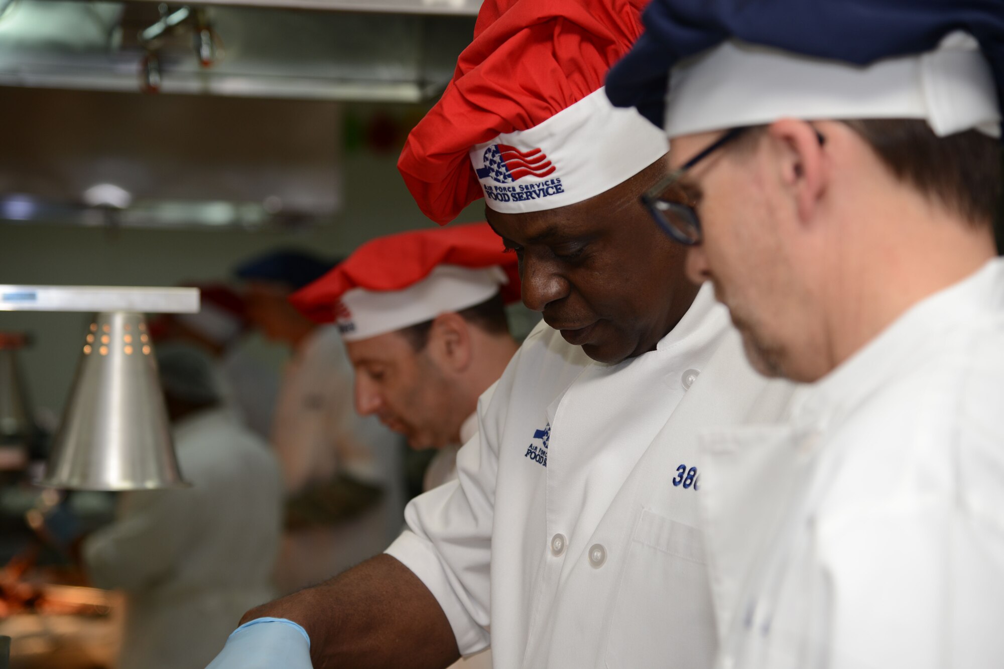 SOUTHWEST ASIA - U.S. Army Gen. Lloyd J. Austin III, U.S. Central Command commander (right) serves Thanksgiving meals to joint and coalition service members here Nov. 27. Austin spent the day serving meals and talking to service members. (U.S. Air Force photo by Staff Sgt. Warren Spearman/released)