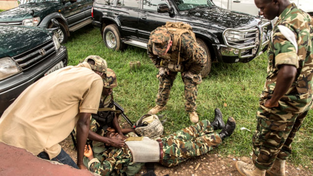 Petty Officer 3rd Class Zachary Gibson instructs soldiers with the Burundi National Defense Force on combat lifesaving techniques in Bujumbura, Burundi, Nov. 6, 2014. During the simulation, the BNDF soldier was the victim of an improvised explosive device explosion, evacuated by a fellow soldier and treated by a [BNDF Corpsman]. Gibson is a corpsman with SPMAGTF-Crisis Response-Africa, training alongside the BNDF, teaching basic infantry tactics, engineering, logistical support, countering-IED, lifesaving techniques, and convoy operations to prepare them for an upcoming deployment in support of the African Union Mission in Somalia (AMISOM). (U.S. Marine Corps photo by Cpl. Shawn Valosin)