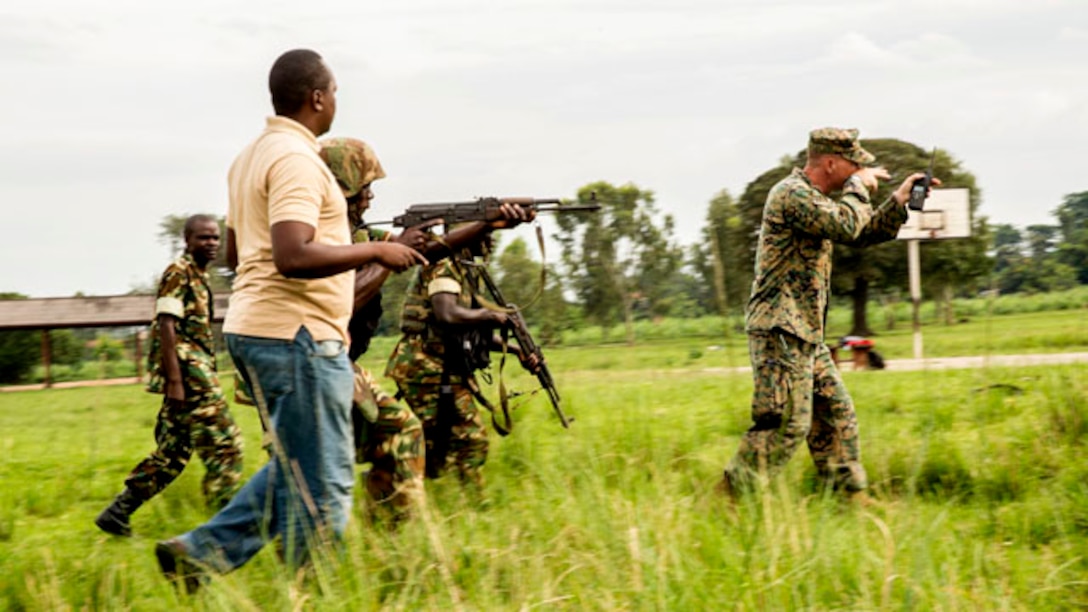 Staff Sergeant Jay Baldino instructs soldiers with the Burundi National Defense Force on infantry tactics in Bujumbura, Burundi, Nov. 6, 2014. Baldino is an infantry unit leader with SPMAGTF-Crisis Response- Africa, training alongside the BNDF, teaching basic infantry tactics, engineering, logistical support, countering-improvised explosive devices, lifesaving techniques, and convoy operations to prepare them for an upcoming deployment in support of the African Union Mission in Somalia (AMISOM). According to their website, AMISOM is tasked with “carrying out support for dialogue and reconciliation by assisting with free movement, safe passage and protection of all those involved in a national reconciliation congress involving all stakeholders, including political leaders, clan leaders, religious leaders and representatives of civil society.” (U.S. Marine Corps photo by Cpl. Shawn Valosin)