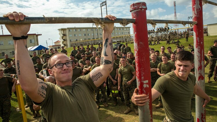 Cpl. Zach Martin from Cleveland, Ohio, struggles for one more repetition at the pull up challenge Nov. 14 during the Shanghai Commanders’ Cup. “Some of the stuff we did today had ties to our normal training but a lot of it was fun and enjoyable,” said Martin. “Our schedule out here is hectic with a lot of moving parts and not much time in any one place. Today was a good way to boost the morale of the guys and prepare us for a mentally, physically psychologically long, yet chronologically short deployment.” Martin is a rifleman with 1st Battalion, 1st Marine Regiment, currently assigned to 4th Marine Regiment, 3rd Marine Division, III Marine Expeditionary Force, under the unit deployment program. 