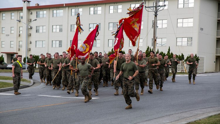 Col. David L. Odom, right, runs with Sgt. Maj. Mario P. Fields leading 4th Marine Regiment during the motivational run Nov. 14 as the initial event of the Shanghai Commanders’ Cup at Camp Schwab. Marines from Camp Pendleton, Camp Lejuene, Marine Corps Base Hawaii and Camp Schwab all participated in the commanders’ cup. Fields, from Jacksonville, North Carolina, is the sergeant major for 4th Marine Regiment, 3rd Marine Division, III Marine Expeditionary Force. Odom, from Hartsville, South Carolina, is the commanding officer of 4th Marines. 