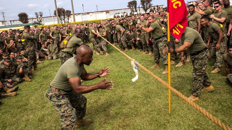 Sgt. Maj. Mario P. Fields judges the championship tug-of-war match between 1st Battalion, 1st Marine Regiment, and 1st Battalion, 3rd Marine Regiment, Nov. 14 during the Shanghai Commanders’ Cup. The Marines were challenged in nine events throughout the day. The crowd cheered as 1st Marines pulled their way to victory in tug-of-war and also claimed the commanders’ cup. The Marines are with various units from 4th Marine Regiment, 3rd Marine Division, III Marine Expeditionary Force. Fields, from Jacksonville, North Carolina, is the sergeant major of 4th Marines. 