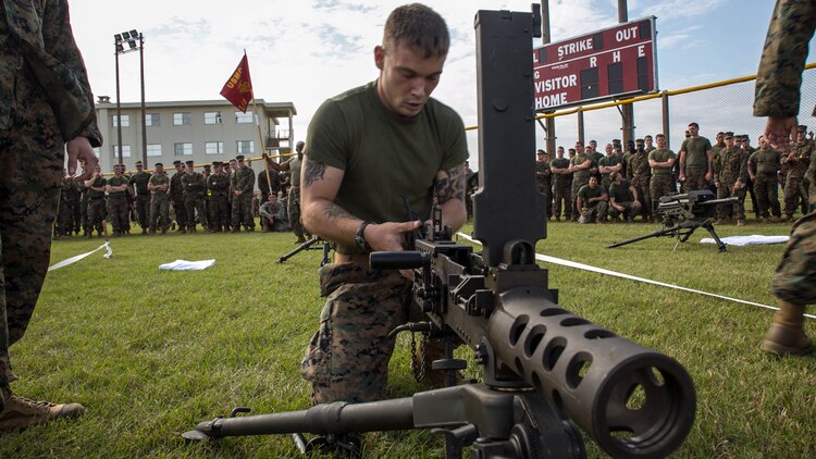 Sgt. Joshua Houck, from Rochester, New York, disassembles a M2 .50-caliber Browning machine gun Nov. 14 as part of the weapons relay event of the Shanghai Commanders’ Cup at Camp Schwab. The weapons relay tested teams of Marines to disassemble and reassemble six weapons ranging from the smallest, M9A1 9 mm service pistol, and progressing to the largest, MK 19 40 mm automatic grenade launcher. Houck is a machine-gunner with 1st Battalion, 3rd Marine Regiment, currently assigned to 4th Marine Regiment, 3rd Marine Division, III Marine Expeditionary Force, under the unit deployment program. 