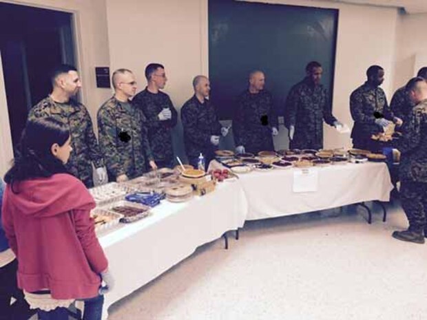 MCESG HQ staff ready to pass out Thanksgiving meal