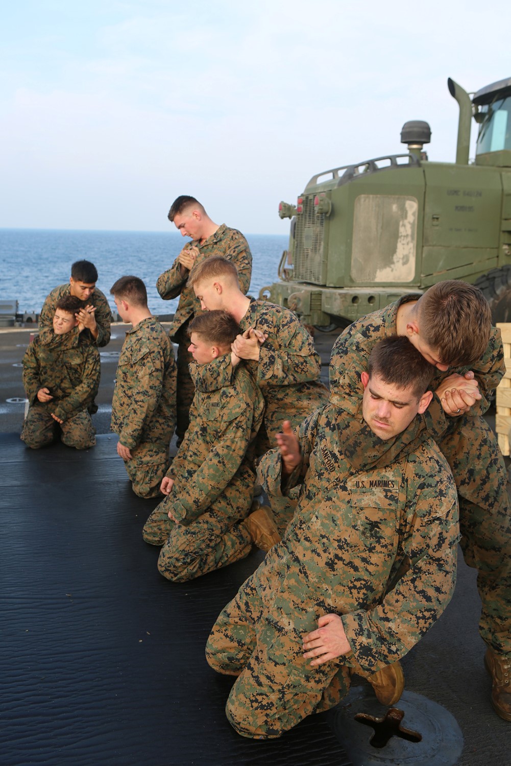 Marines with the 11th Marine Expeditionary Unit (MEU), practice a technique from the Marine Corps Martial Arts Program (MCMAP) aboard dock landing ship USS Comstock (LSD 45), Nov. 24. The 11th MEU is deployed with the Makin Island Amphibious Ready Group (ARG) as a theater reserve and crisis response force throughout U.S. Central Command and the U.S. 5th Fleet area of responsibility. (U.S. Marine Corps photo by Sgt. Melissa Wenger/Released)