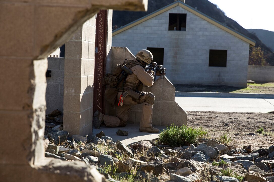 U.S. Marine Cpl. Brendan Berndt posts security during interoperability training aboard Camp Pendleton, Calif., Nov. 20, 2014. Berndt is a slack man with the 15th Marine Expeditionary Unit’s Maritime Raid Force. Interop gives the 15th MEU’s MRF and Security Element an opportunity to work together and support each other in preparation for a deployment in the spring. (U.S. Marine Corps photo by Cpl. Anna Albrecht/Released)
