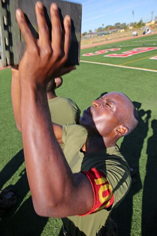 Recruit Jared D. Williams, Platoon 1014, Alpha Company, 1st Recruit Training Battalion, conducts ammunition can lifts during the Combat Fitness Test at Marine Corps Recruit Depot San Diego, Calif., Nov. 20. Williams is a Savannah, Ga., native and was recruited out of Recruiting Sub Station El Paso, Texas.