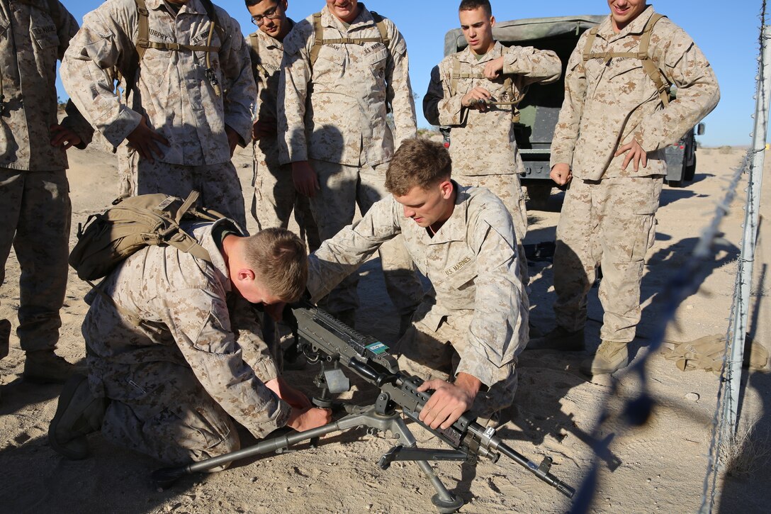 Marines and sailors of 3rd Light Armor Reconnaissance Battalion, assemble a M240B medium machinegun during one of the events for the 3rd LAR field meet aboard the Combat Center, Nov. 20, 2014. The competition commenced at Del Valle Field at approximately 6:30 a.m. with each team departing the field two minutes apart. (Official Marine Corps photo by Pfc. Medina Ayala-Lo/Released)