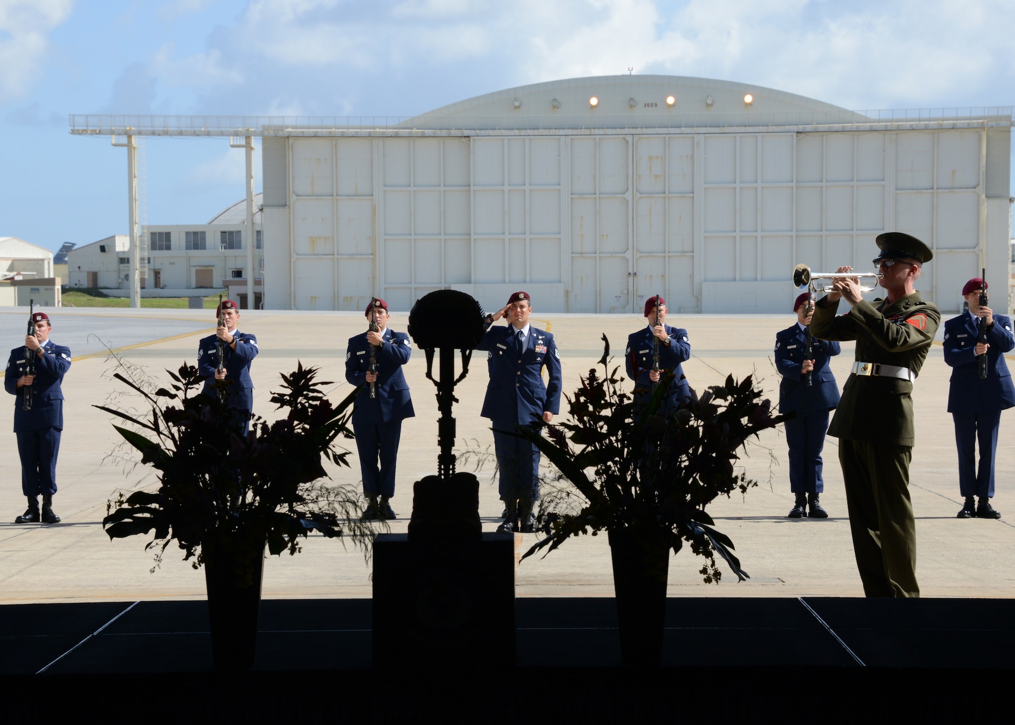 The firing party stands and salutes after conducting a three volley salute while a bugler plays Taps during a memorial service held for Tech. Sgt. Sean Barton Nov. 25, 2014 at Kadena Air Base, Japan.  Barton, a 320th Special Tactics Squadron pararescueman, died Oct. 30 from injuries sustained after a rappelling incident during a joint exercise training event near Kathmandu, Nepal.  (U.S. Air Force photo by Tech. Sgt. Kristine Dreyer)