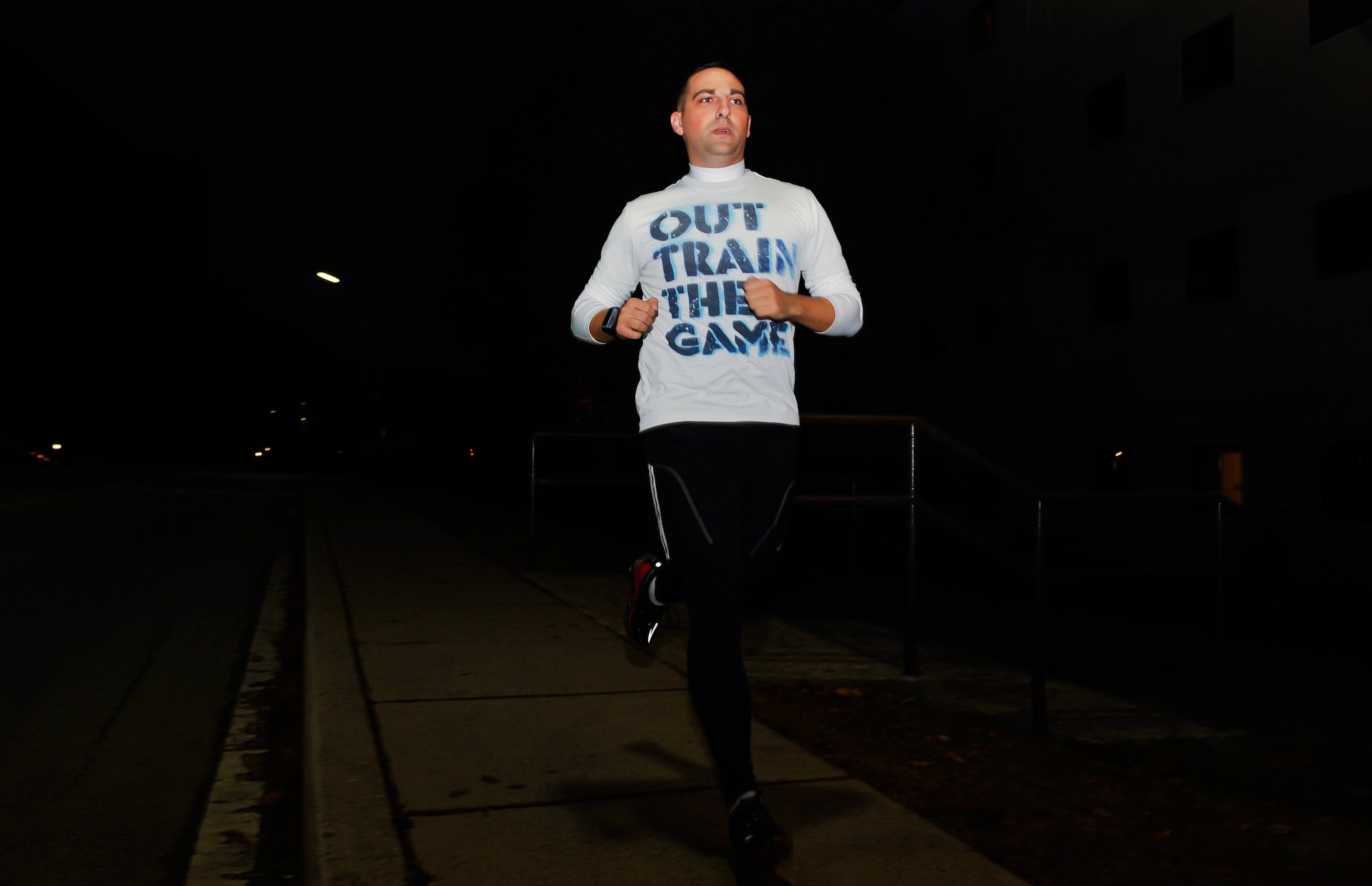 Staff Sgt. Chad Beighley, 607th Air Operations Center processing, exploitation and dissemination analyst, runs on the sidewalk Nov. 24, 2014, on Osan Air Base, Republic of Korea. Beighley is this week’s Airman Spotlight winner. (U.S. Air Force photo by Senior Airman David Owsianka)