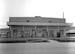 Service members walk by the Base Theater in 1960 on Osan Air Base, Republic of Korea. (Courtesy photo by Mac Hayes)