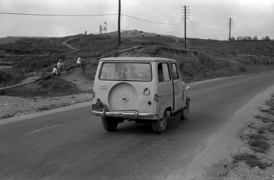 A taxi drives by the barracks in 1960 on Osan Air Base, Republic of Korea. (Courtesy photo by Mac Hayes)