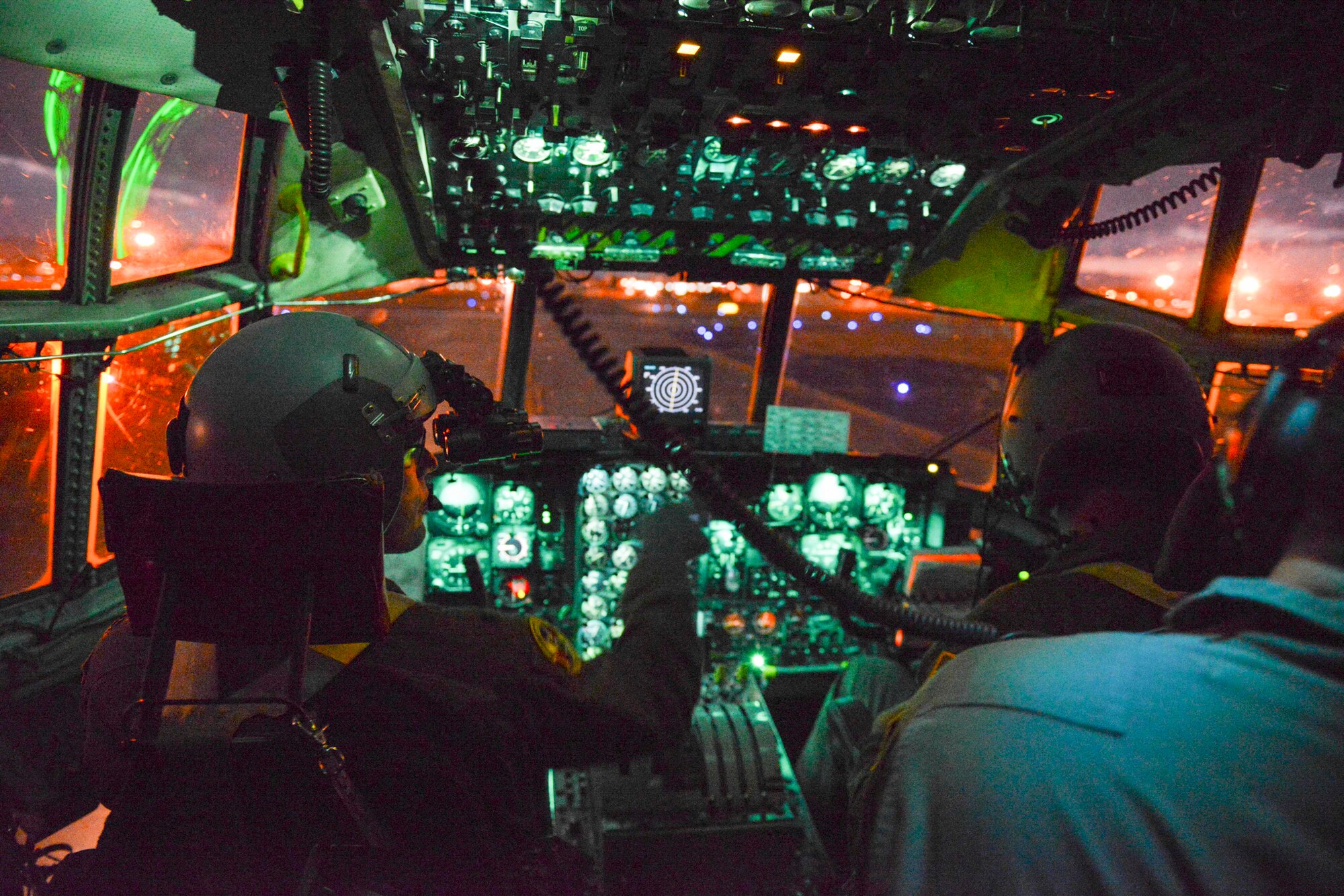 Lt. Col. Andrew Campbell, 36th Airlift Squadron commander, prepares for takeoff during KEEN SWORD 2015 at Yokota Air Base, Japan, Nov. 13, 2014.  The flight consisted of a Low-Cost, Low-Altitude drop and night flight operations to enhance pilots: ability to operate in the dark.  (U.S. Air Force photo by Airman 1st Class Soo C. Kim / Released)