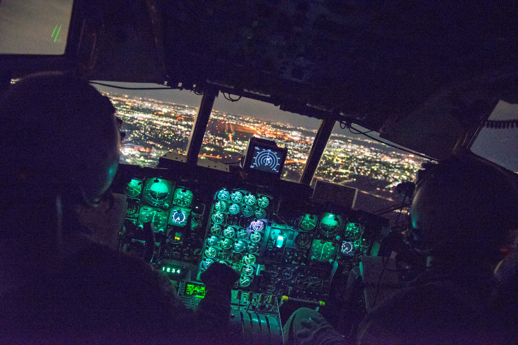 Lt. Col. Andrew Campbell, 36th Airlift Squadron commander, prepares to land a C-130 Hercules during KEEN SWORD 2015 at Yokota Air Base, Japan, Nov. 13, 2014.  KEEN SWORD is a bilateral exercise between JASDF and U.S. service members, aimed to increase readiness to defend and support various crisis situations in the Pacific theater.  (U.S. Air Force photo by Airman 1st Class Soo C. Kim / Released)