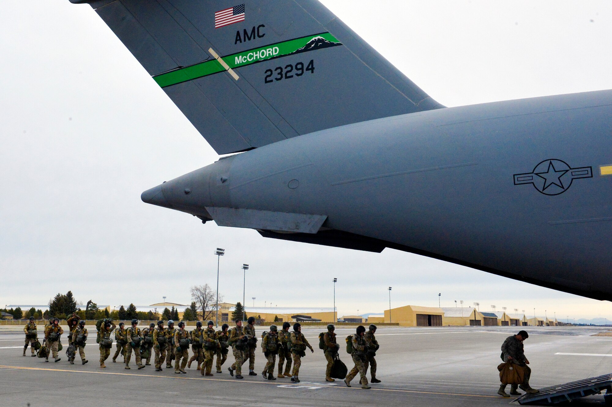 Airmen from the 22nd Training Squadron board a McChord Field C-17 Globemaster III in order to accomplish jump training Nov. 24, 2014, at Fairchild Air Force Base, Wash. The 22nd TRS is part of the 336th Training Group at Fairchild AFB and are the sole unit responsible for training the Survival, Evasion, Resistance, Escape specialists who in turn train more than 6,000 students a year from their base. (U.S. Air Force photo/Staff Sgt. Russ Jackson)