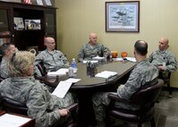 Master Sgt. Patrick Hill, 28th Medical Group first sergeant, briefs the 28th MDG leadership on how Airmen are doing within their group and squadrons inside the 28th MDG facility at Ellsworth Air Force Base, S.D., Nov. 13, 2014. As the first sergeant, Hill is responsible for the morale, welfare, and conduct of all members in the 28th MDG. (U.S. Air Force photo by Senior Airman Anania Tekurio/Released)