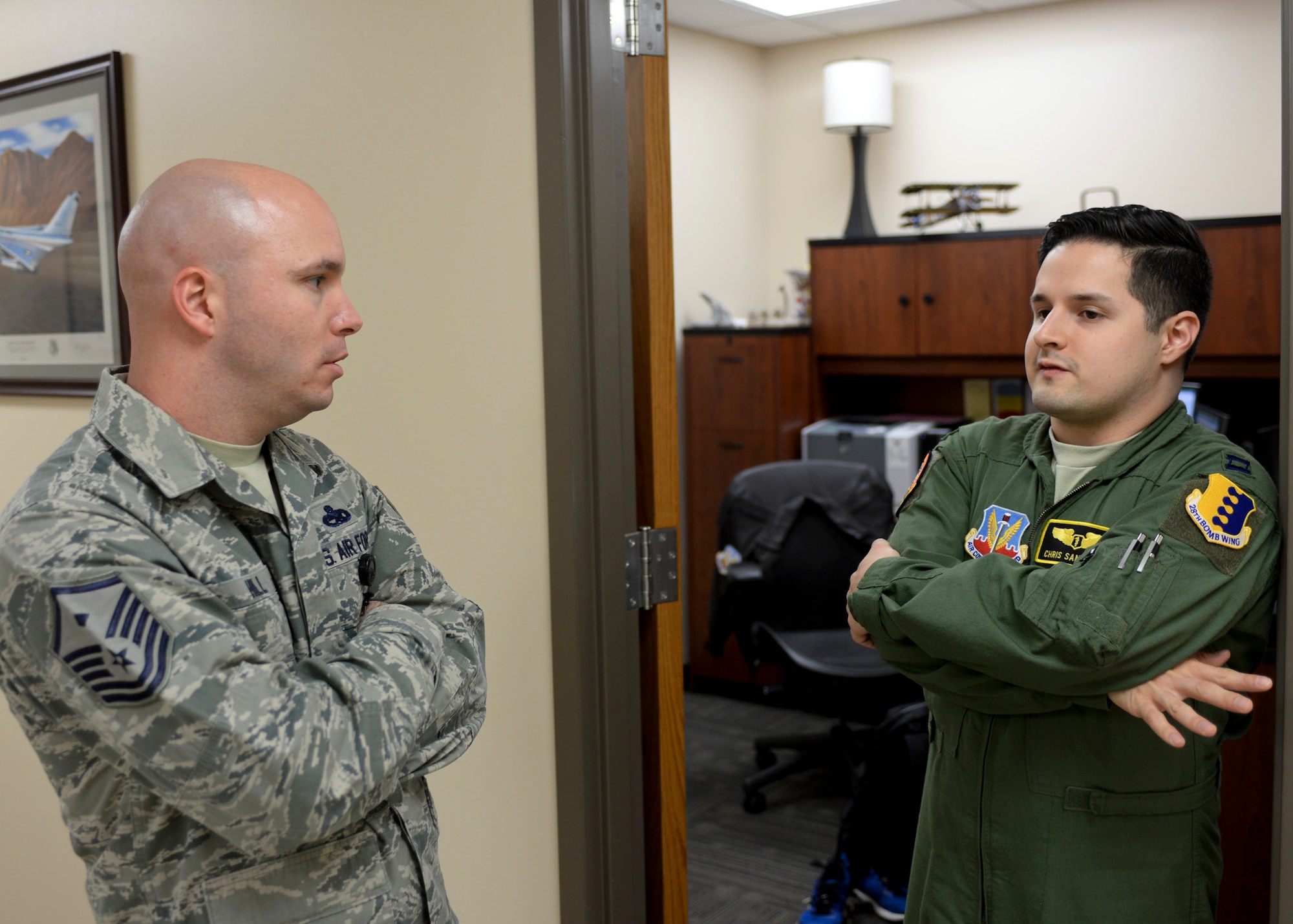 Master Sgt. Patrick Hill, 28th Medical Group first sergeant, visits with Capt. Christopher Sandoval, 28th Medical Operations Squadron flight surgeon, at Ellsworth Air Force Base, S.D., Nov. 13, 2014. The first sergeant’s primary job is making sure he is properly taking care of his Airmen and leadership in his unit. (U.S. Air Force photo by Senior Airman Anania Tekurio/Released) 