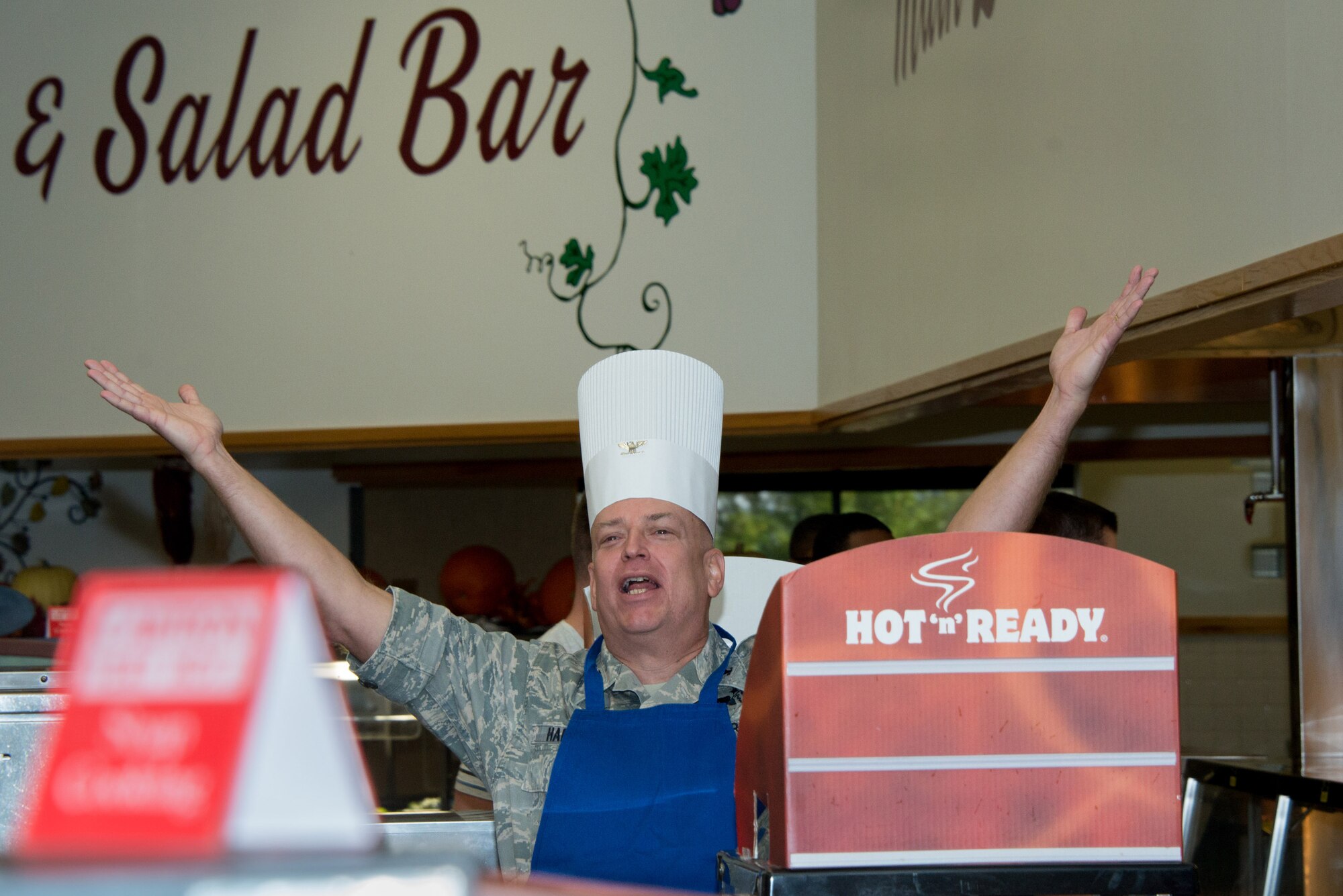 Col. (Dr.) Thomas W. Harrell, 81st Medical Group commander, jokes with Airmen while serving dinner at the Azalea Dining Facility on Thanksgiving Day, Nov. 27, 2014, Keesler Air Force Base, Miss. It is traditional at Keesler for commanders, first sergeants and superintendents to take time out of their holiday to serve a Thanksgiving meal at the dining facilities to their Airmen. (U.S. Air Force photo by Marie Floyd)