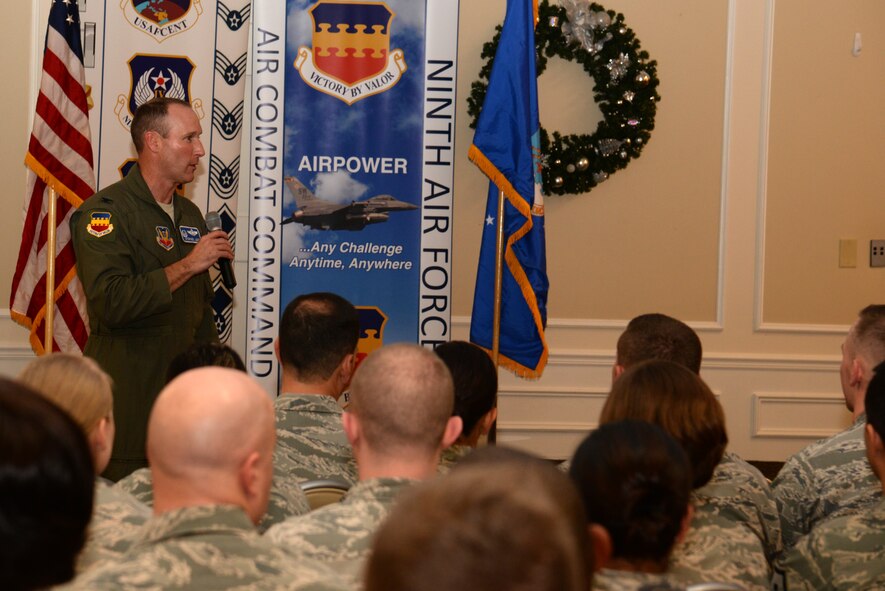 U.S. Air Force Col. Stephen Jost, 20th Fighter Wing commander, delivers remarks during the enlisted promotion ceremony for the month of November at Shaw Air Force Base, S.C., Dec. 1, 2014. Jost thanked the Airmen and their families for their service, dedication, and commitment to the Air Force and challenged them to always strive to be a better Airman, spouse, parent, and friend. (U.S. Air Force photo by Airman 1st Class Jonathan Bass/Released)