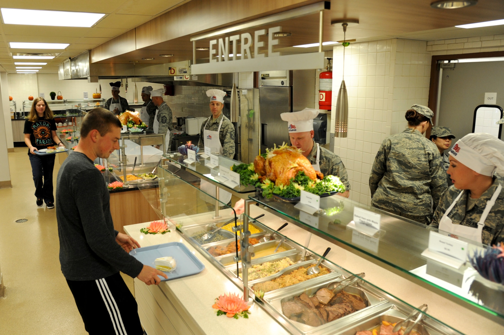 Team Barksdale leadership serves food to Airmen during the Red River Dining Facility Thanksgiving lunch on Barksdale Air Force Base, La., Nov. 27, 2014. The traditional meal included turkey, ham, beef, a variety of sides and dessert. (U.S. Air Force photo/ Senior Airman Jannelle Dickey) 