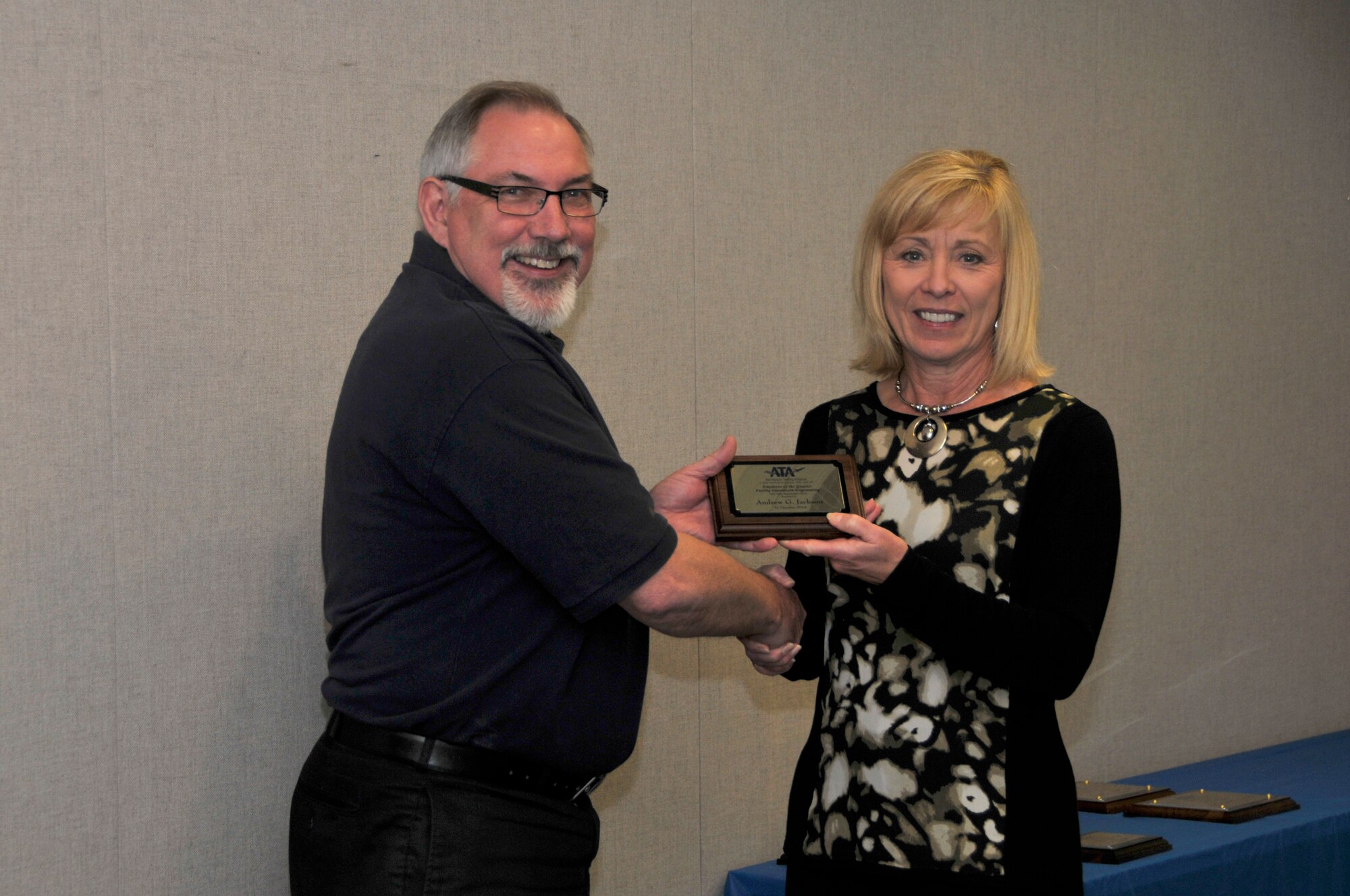 Andrew Jackson (left), with the ATA Integrated Test and Evaluation Department, accepts the ATA Operations and System Engineer of the Quarter Award from Debbie Bayer, the ATA deputy director of the ATA Test Assets and Support Department.