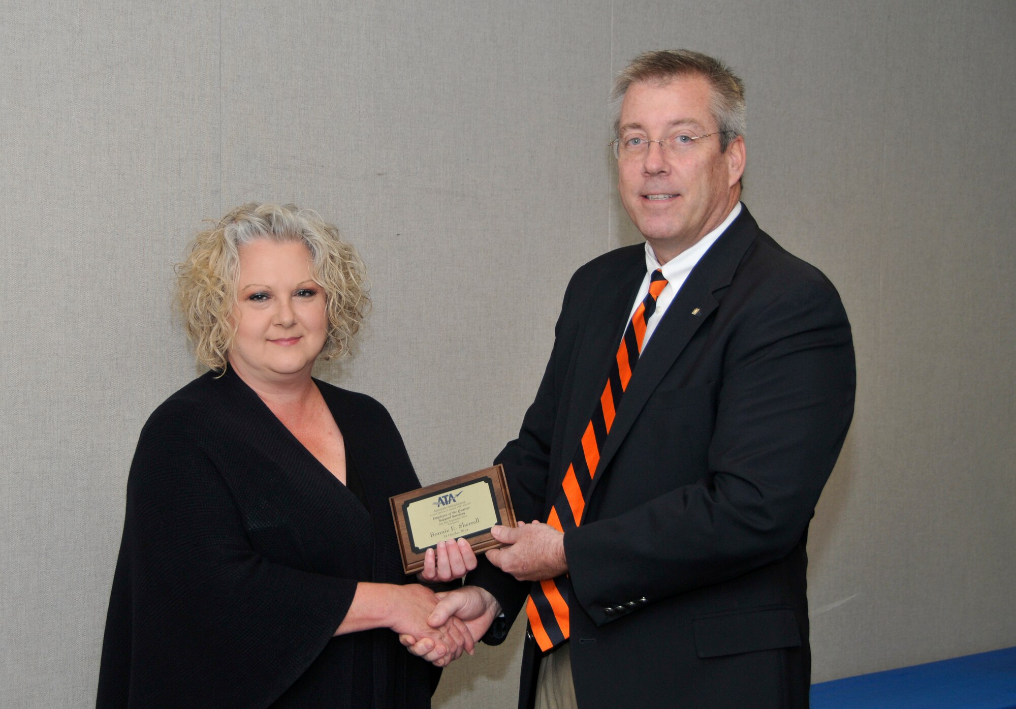 Elise Sherrell (left), with the ATA Mission Support Department, accepts the ATA Administrative and Professional Support Services of the Quarter Award from ATA Deputy General Manager Jeff Haars.