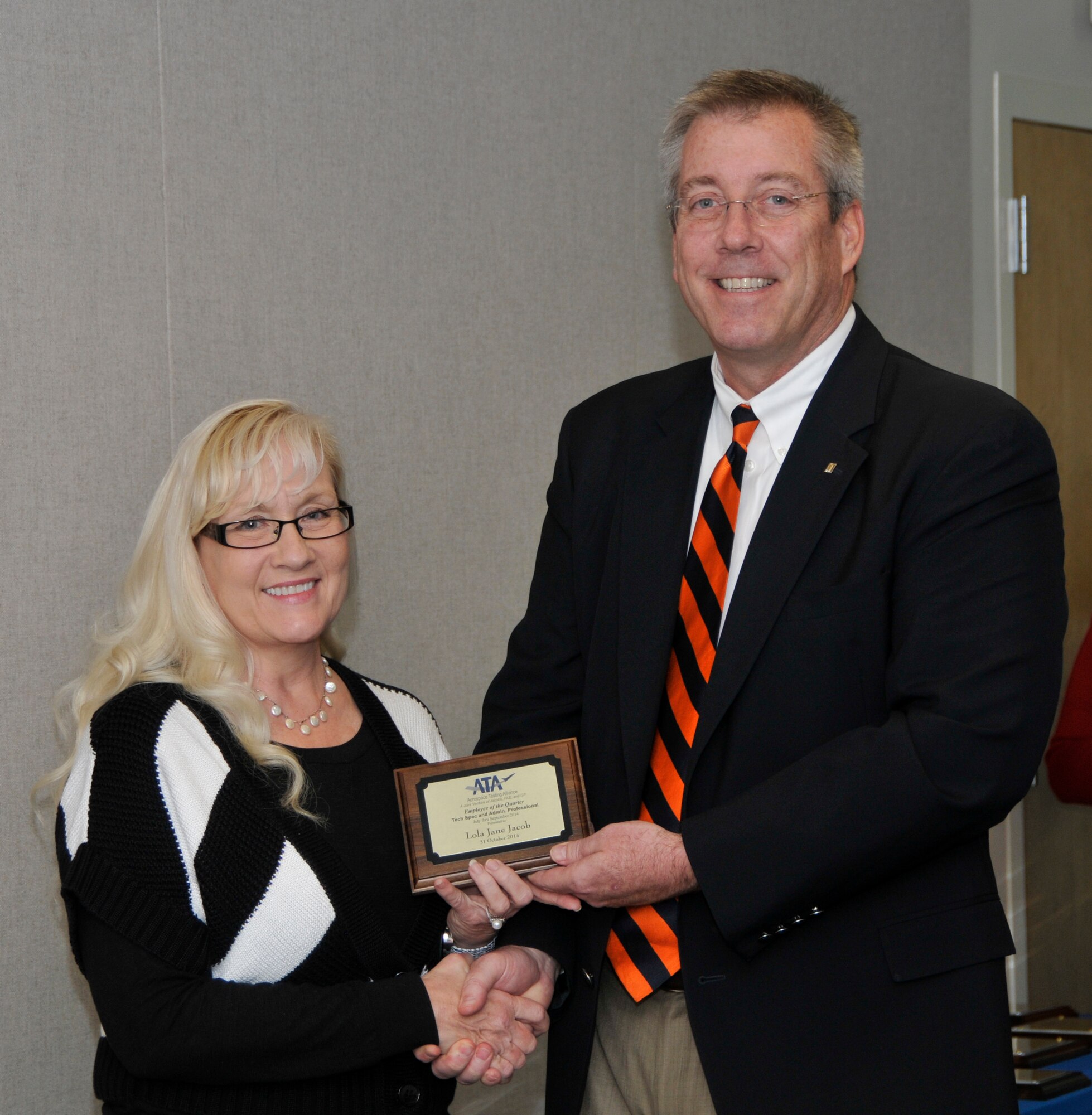 Lola Jane Jacob (left), with the ATA Integrated Test and Evaluation Department, accepts the ATA Administrative and Professional Support Services of the Quarter Award from ATA Deputy General Manager Jeff Haars.