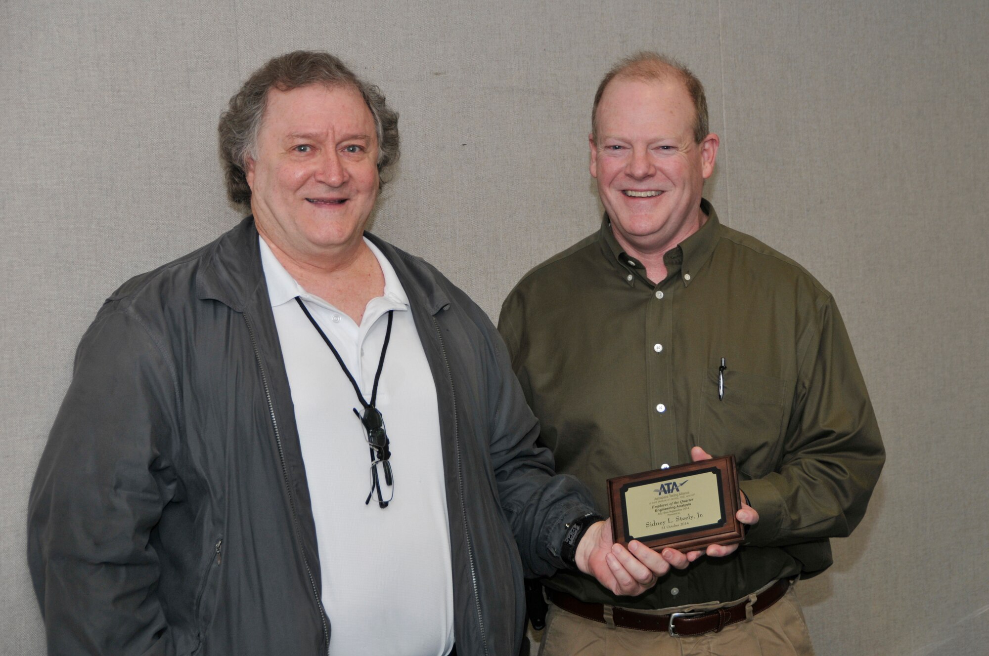 Sidney Steely Jr. (left), with the ATA Integrated Test and Evaluation Department, accepts the ATA Technical Excellence in Engineering of the Quarter Award from Scott Bartlett, the ATA Performance Management Department chief engineer.