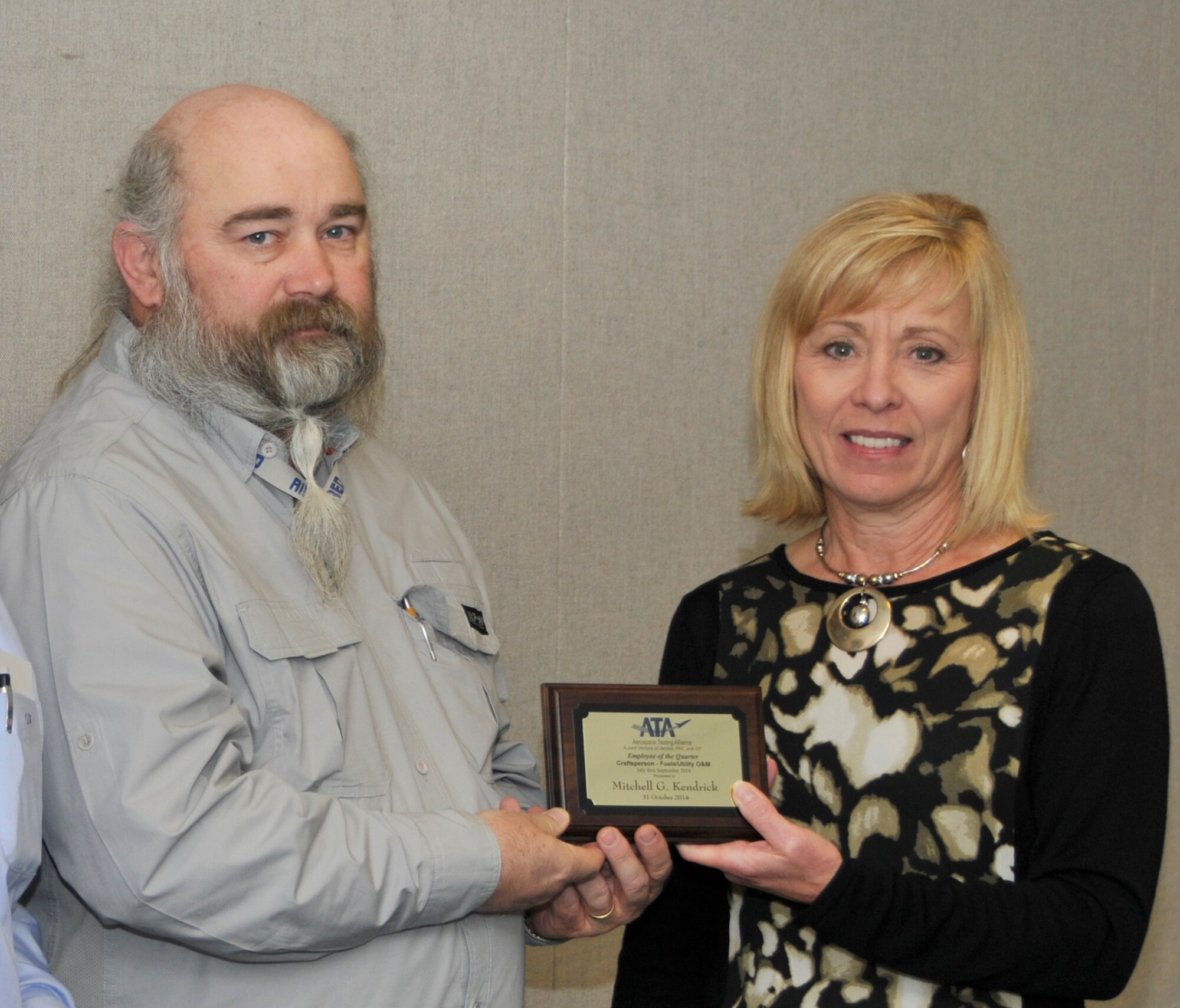 Mitchell Kendrick (left), with the ATA Mission Support Department, accepts the ATA Craftsperson of the Quarter Award from Debbie Bayer, the ATA deputy director of the ATA Test Assets and Support Department.