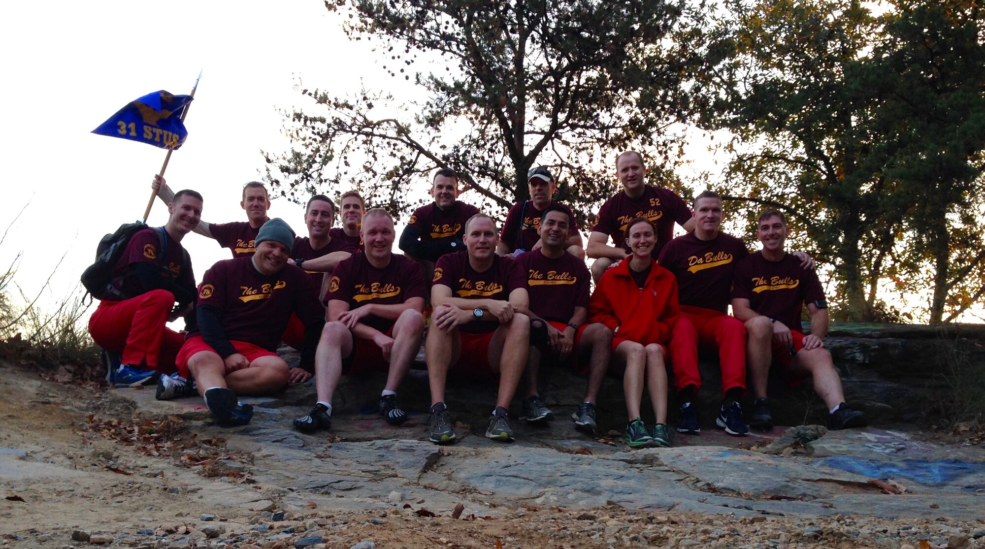 Members of the 31st Student Squadron ‘Bulls’ from the Air University Squadron Officer School, located at Maxwell Air Force Base, Alabama, pose for a photo after completing their 3-mile, 800-foot jog to the peak of Currahee Mountain located in Toccoa, Georgia.  The Bulls were commemorating the round-trip run taken by the Army’s 506th Parachute Infantry Regiment during World War II.  (Air Force Photo by Capt. Christopher Quinlan/Cleared)