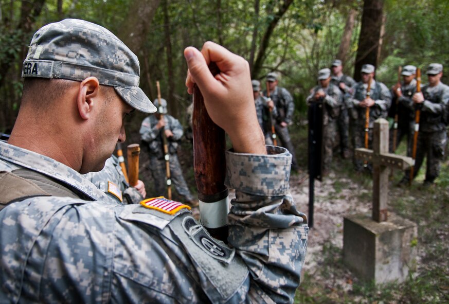Staff Sgt. Ariel Rivera and Soldiers from the 6th Ranger Training Battalion observe a moment of silence at the memorial on Eglin Air Force Base, Fla., for the four fallen Rangers who lost their lives Feb. 16, 1995. More than 40 Soldiers participated in the excursion Sept. 25 that followed in the footsteps of the tragic squad to learn from their experience and understand what took place that night almost 20 years ago.
