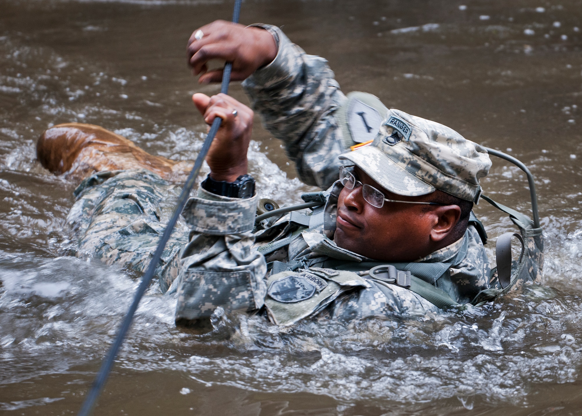 A 6th Ranger Training Battalion Soldier crosses the water using a rope to get to a memorial on Eglin Air Force Base, Fla., for the four fallen Rangers who lost their lives Feb. 16, 1995. More than 40 Soldiers participated in the excursion Sept. 25 that followed in the footsteps of the tragic squad to learn from their experience and understand what took place that night almost 20 years ago.