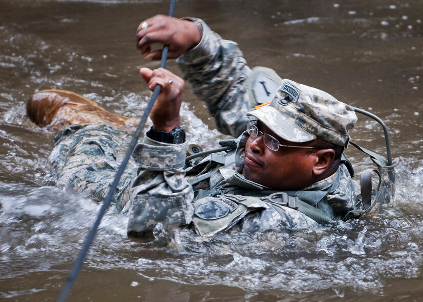 A 6th Ranger Training Battalion Soldier crosses the water using a rope to get to a memorial on Eglin Air Force Base, Fla., for the four fallen Rangers who lost their lives Feb. 16, 1995. More than 40 Soldiers participated in the excursion Sept. 25 that followed in the footsteps of the tragic squad to learn from their experience and understand what took place that night almost 20 years ago.