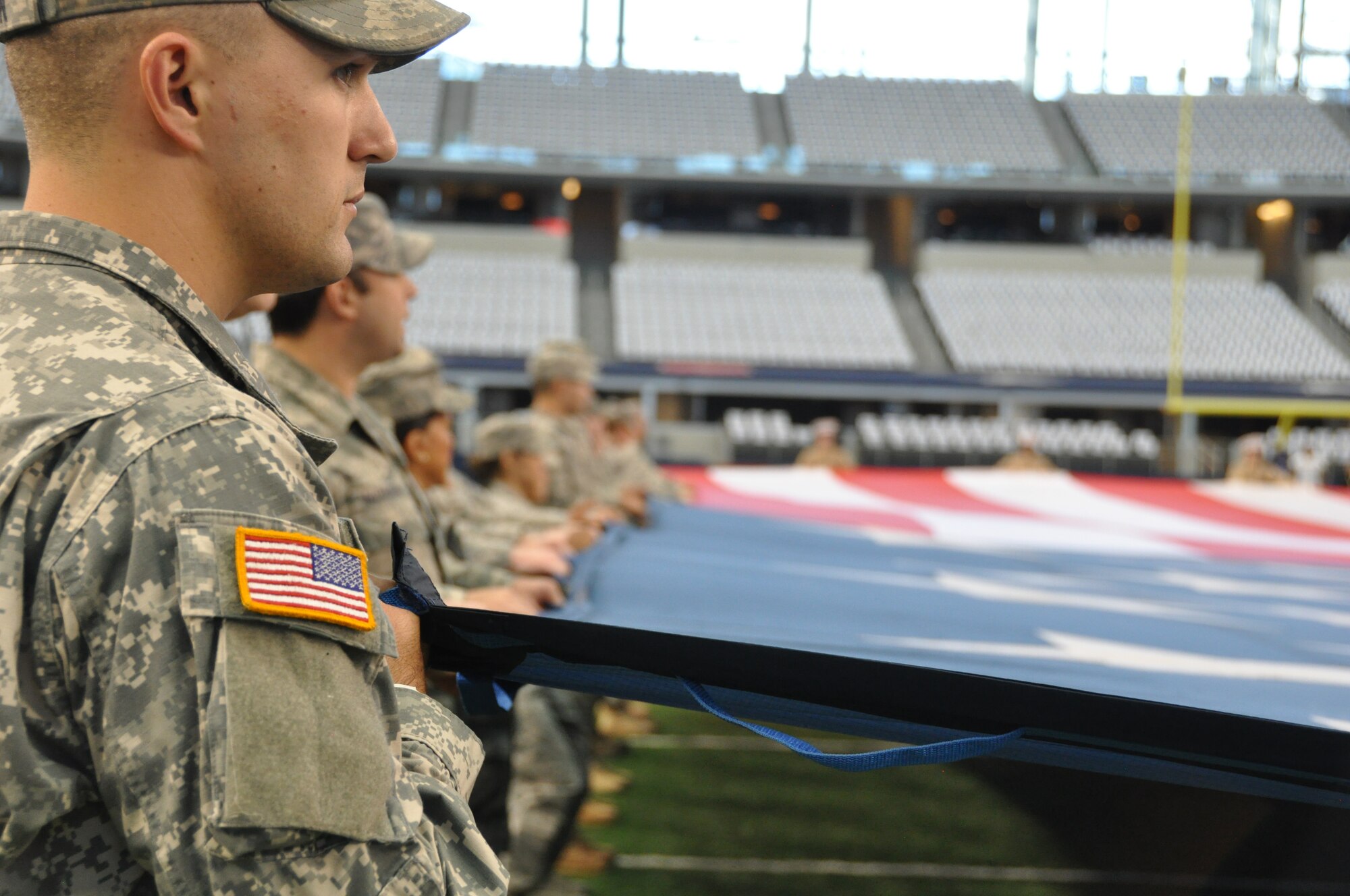 NAVAL AIR STATION FORT WORTH JOINT RESERVE BASE, Texas - Approximately 75 servicemembers practice unraveling and holding the flag on the field before the Dallas Cowboys' Thanksgiving game at AT&T Stadium, Arlington, Texas Nov. 27, 2014. (U.S. Air Force photo/Capt. Candice Allen)